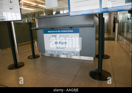 View of a US Visit sign on a passport control booth at Terminal 4 of JFK airport in New York City USA April 2006 Stock Photo