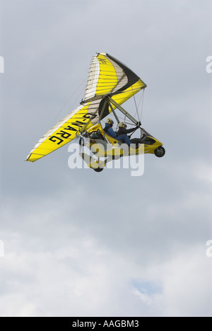 Brightly Coloured Microlight over Popham Airfields, Hampshire England Stock Photo