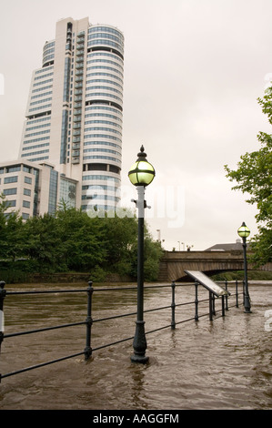 25 June 2007 Flooded River Aire tow path at Sovereign Street, Leeds, with Bridgewater Place & Victoria Bridge in background. Stock Photo