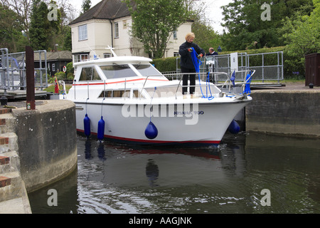 Pleasure boat leaving the lock at Marlow on the River Thames Buckinghamshire Stock Photo