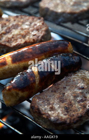 Barbecue barbecued bbq flame grill grilled fire smoke flavor coal charcoal ash food poisoning sausage beef burger beef burger b Stock Photo