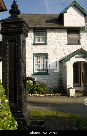 Old schoolhouse building and victorian village water pump Llanuwchllyn near Bala Gwynedd snowdonia national park north wales Stock Photo