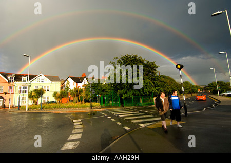 Double rainbow over street and houses Aberystwyth Wales UK Stock Photo