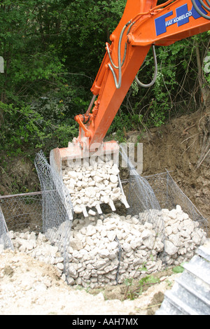 Wire  cages.'gabbia del legare ' used to prevent land slip   being filled with stone. Stock Photo