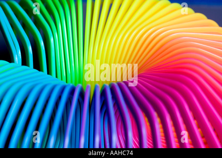 Rainbow colored plastic slinky toy Stock Photo