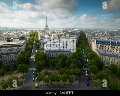 Aerial view over Paris skyline with wide boulevards the Eiffel Tower and nice clouds  Paris France Stock Photo