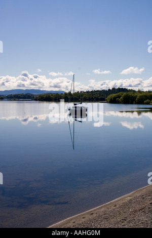 Sailing boat at anchor on Loch Lomond near Luss Pier, Luss, Argyll and Bute, Scotland Stock Photo