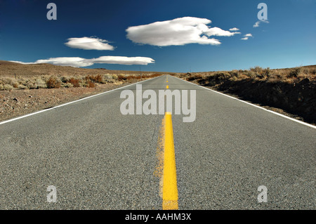 Empty road in the middle of the desert, Eastern Sierra Mountains, California Stock Photo