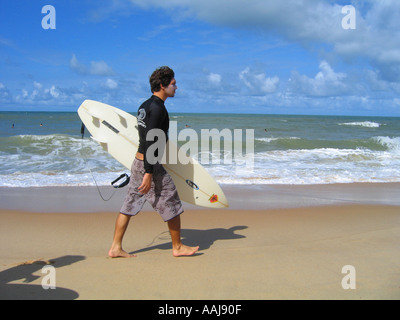 Young Brazilian surfers on Praia do Ponta Negra beach in Natal Brazil Stock Photo