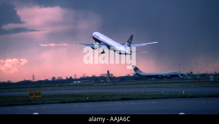 Passenger jet aircraft taking off from Heathrow airport Stock Photo