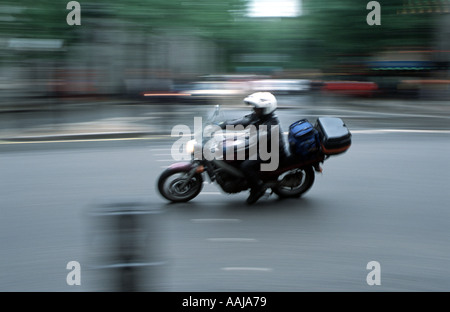 Motor cycle messenger courier in London Stock Photo