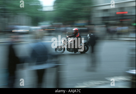 Motor cycle messenger in London Stock Photo