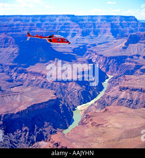 Helicopter taking tourists on a trip over the Grand Canyon National Park, Arizona, USA Stock Photo