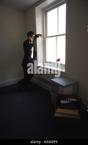Young businessman in empty office Stock Photo