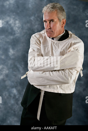 Executive in a strait jacket Stock Photo
