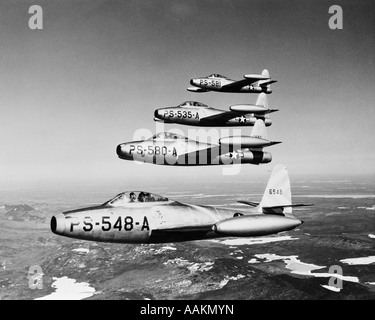 1950s FOUR US AIR FORCE THUNDER JETS IN FLIGHT FORMATION Stock Photo