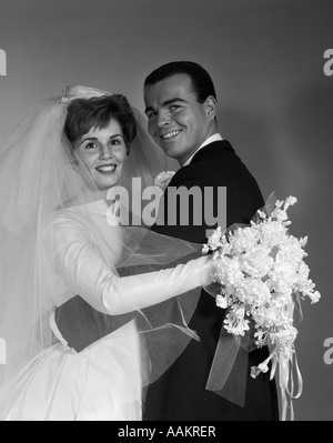 1960s WEDDING BRIDE AND GROOM PORTRAIT LOOKING AT CAMERA Stock Photo