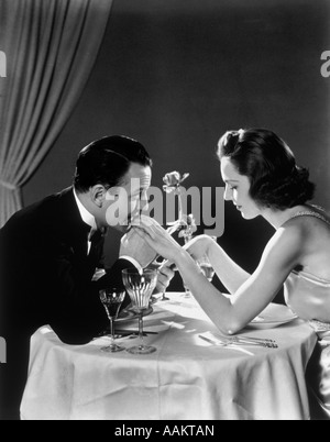 1930s ROMANTIC COUPLE MAN WOMAN ELEGANT DINNER TABLE Stock Photo - Alamy