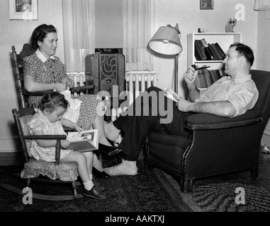1930s-40s FAMILY RELAXING NEAR RADIO Stock Photo