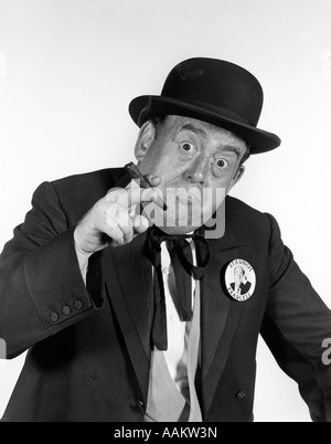 1950s PORTRAIT MAN WEARING OLD-TIME POLITICIAN COSTUME POINTING TOWARD LOOKING AT CAMERA WITH CIGAR IN HAND Stock Photo