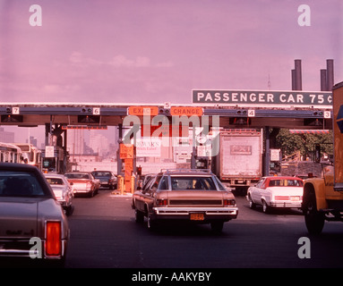 1960s CARS AT TOLL BOOTH OF QUEENS MIDTOWN TUNNEL NEW YORK CITY Stock Photo