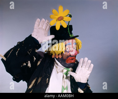 HOBO STYLE CLOWN WEAR TOP HAT WITH DAISY PERFORMER FUNNY Stock Photo