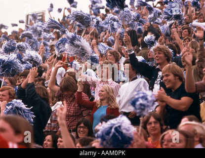 1970s CROWD COLLEGE STUDENTS FOOTBALL GAME WAVING POM POMS CHEERING FANS BEAVER STADIUM PENNSYLVANIA Stock Photo