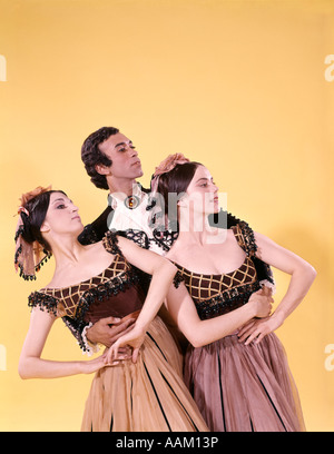 1970s SPANISH BALLET DANCER MAN TWO WOMEN COSTUMES POSED TOGETHER Stock Photo