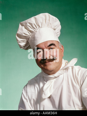 1960s MAN CHEF WEARING HAT TOQUE WHITE COAT UNIFORM Stock Photo