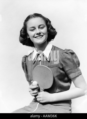 1940s SMILING TEEN GIRL HOLDING PING PONG BALL AND PADDLE Stock Photo