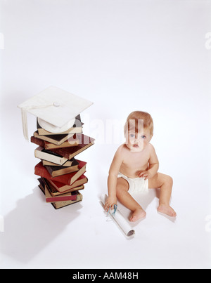 Mortar board with stack of books and diploma on white background Stock ...