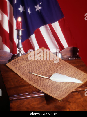 1776 COLONIAL AMERICA FLAG PARCHMENT OF UNITED STATES CONSTITUTION ON DESK QUILL CANDLE PATRIOTIC GOVERNMENT FREEDOM Stock Photo