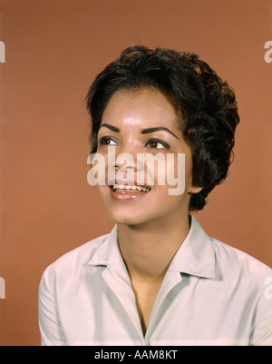 1960s PORTRAIT SMILING AFRICAN-AMERICAN WOMAN LOOKING TO SIDE Stock Photo