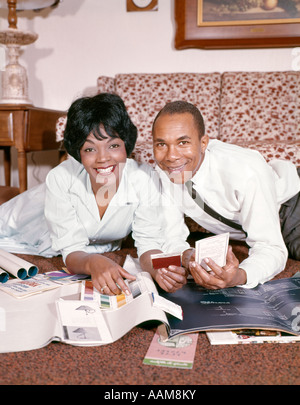 1960s 1970s African American Couple Working On Family Finances Looking 