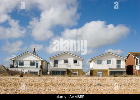 Holiday homes on the beach in East Sussex UK Stock Photo