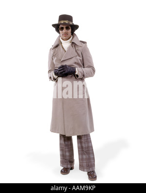 MAN IN TRENCHCOAT AND HAT AND SUNGLASSES Stock Photo