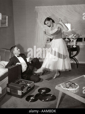 1950s 1960s TEENAGE GIRL SMILING RECLINING UPSIDE DOWN ON CHAIR Stock ...