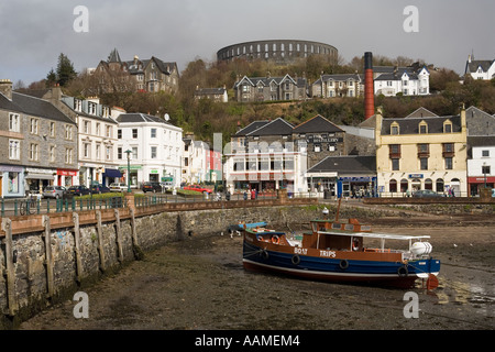 UK Scotland Argyll Oban city centre and McCaigs Tower from the harbour Stock Photo