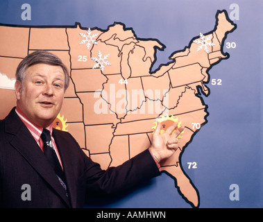 1970s TV WEATHERMAN POINTING TO MAP Stock Photo