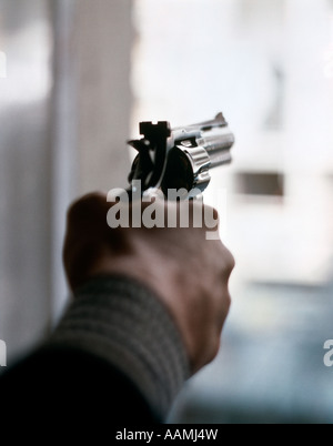 aiming with an old revolver Stock Photo - Alamy