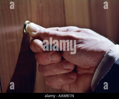 1970 1970s MANS HAND PUSHING DOORBELL DOORBELLS BUTTON BUTTONS PUSH RING RINGING Stock Photo