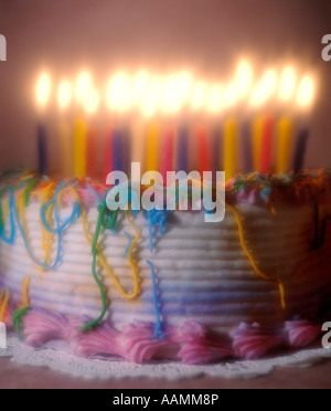 birthday cake with lighted candles on the plate Stock Photo - Alamy