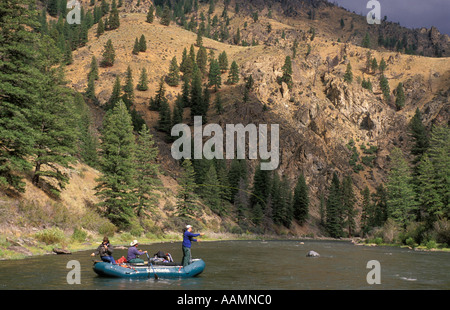IDAHO Man Fly Fishing from raft Middle Fork Salmon of the River Frank Church Wilderness Stock Photo