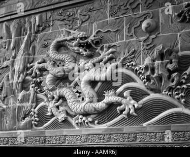 1920s 1930s DETAIL NINE DRAGON SCREEN IN WINTER PALACE FORBIDDEN CITY PEKING BEIJING CHINA Stock Photo