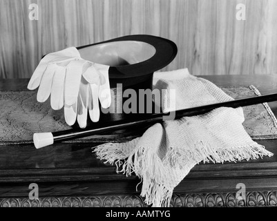 1920s 1930s MAN'S FORMAL EVENING WEAR TOP HAT WHITE GLOVES SCARF AND CANE FOR NIGHT ON THE TOWN Stock Photo