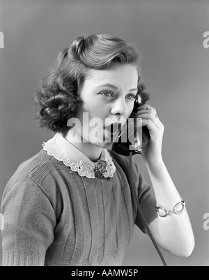 1940s YOUNG GIRL TALKING ON TELEPHONE Stock Photo