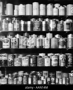 1920s 1930s 1940s TIN CANS AND CONTAINERS ON SHELVES Stock Photo