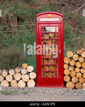 Telephone box used as a log store. Kilmartin near Lochgilphead, Argyll and Bute, Scotland, UK Stock Photo