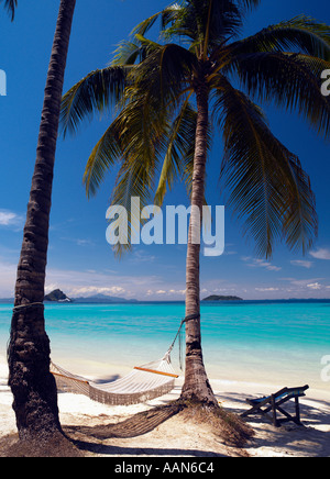Hammock on an idyllic tropical beach on Ko Phi Phi Island near Phuket in the Andaman Sea, Thailand Stock Photo
