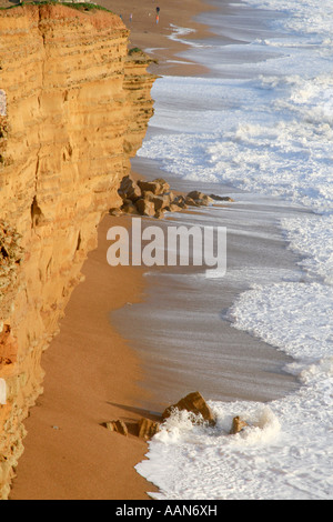 The storm driven tide approaches the base of the cliffs at Burton Bradstock in December 2006 Stock Photo